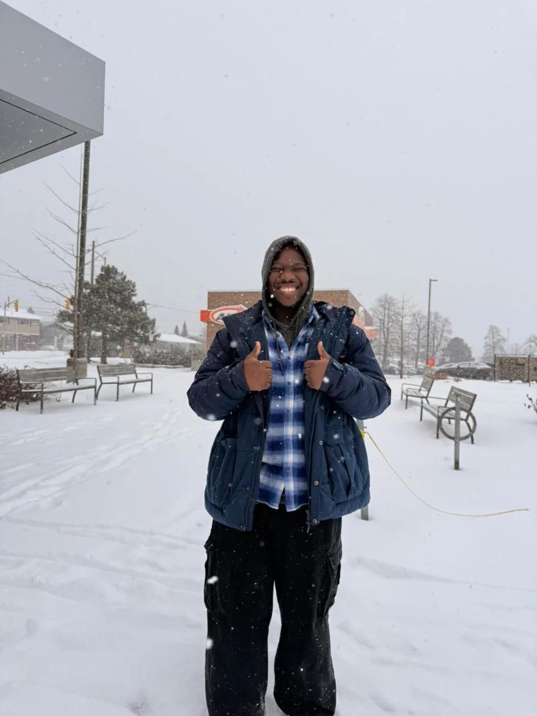 Olu smiling in the snow