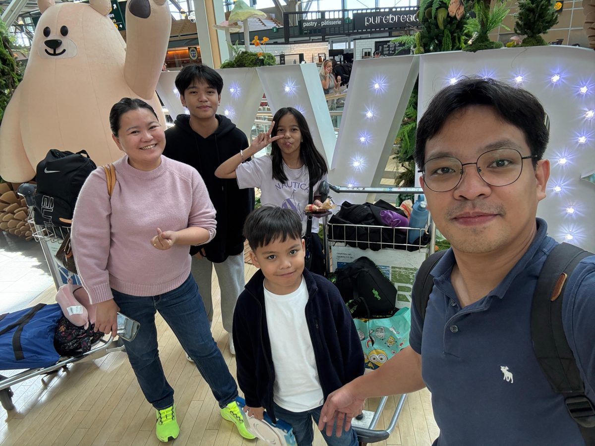 A relocated engineer and his family arriving at Vancouver airport